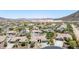 Stunning aerial view of a residential neighborhood featuring tile roofs and mountain views at 12710 W Forest Pleasant Pl, Peoria, AZ 85383