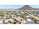 Expansive desert community with tile-roofed homes, mature landscaping, and mountain views at 12710 W Forest Pleasant Pl, Peoria, AZ 85383