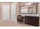Elegant bathroom vanity with decorative mirror, makeup area, and wood look floors at 12710 W Forest Pleasant Pl, Peoria, AZ 85383