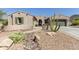 Charming single-story home featuring desert landscaping and a secure gated entrance at 12710 W Forest Pleasant Pl, Peoria, AZ 85383