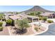 Beautiful house with desert landscaping, a two-car garage, and a charming brick-lined driveway at 12710 W Forest Pleasant Pl, Peoria, AZ 85383