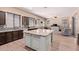 Spacious kitchen boasts granite countertops, stainless steel appliances, and a large center island at 12710 W Forest Pleasant Pl, Peoria, AZ 85383