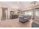 Spacious living area with modern decor, hardwood floors, and sliding glass doors at 12710 W Forest Pleasant Pl, Peoria, AZ 85383
