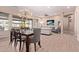 Open floor plan featuring living and dining areas, modern lighting, and hardwood floors at 12710 W Forest Pleasant Pl, Peoria, AZ 85383