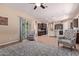 Bright living room with wood floors connects to the kitchen and features comfortable seating at 12710 W Forest Pleasant Pl, Peoria, AZ 85383