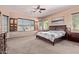 Serene main bedroom offers natural light, carpeted floors, and generous space at 12710 W Forest Pleasant Pl, Peoria, AZ 85383