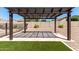Backyard pergola with pavers, gravel landscaping, and desert plants for relaxation at 12710 W Forest Pleasant Pl, Peoria, AZ 85383