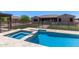 Inviting backyard oasis featuring a private pool, spa, and secure fencing at 12710 W Forest Pleasant Pl, Peoria, AZ 85383
