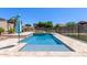 Sparkling pool with a baja shelf, patio, and pergola for luxurious outdoor living at 12710 W Forest Pleasant Pl, Peoria, AZ 85383