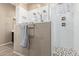 A shower featuring a mosaic tile floor and dual shower heads, enclosed in a sleek glass surround at 12710 W Forest Pleasant Pl, Peoria, AZ 85383