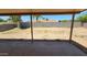 Large fenced backyard with mature trees and a covered patio, perfect for outdoor entertaining at 1414 W Monona Dr, Phoenix, AZ 85027