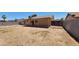A simple backyard features a covered patio ready for your landscaping ideas at 1414 W Monona Dr, Phoenix, AZ 85027