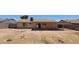 A home with a simple backyard with a covered patio ready for landscaping at 1414 W Monona Dr, Phoenix, AZ 85027
