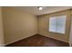 Well-lit bedroom with luxury vinyl plank flooring, large window, and neutral wall color at 1414 W Monona Dr, Phoenix, AZ 85027