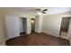 Spacious bedroom with luxury vinyl plank flooring, ceiling fan, closet, and an en-suite bathroom at 1414 W Monona Dr, Phoenix, AZ 85027