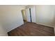Clean bedroom with luxury vinyl plank flooring, base molding, closet, and neutral paint at 1414 W Monona Dr, Phoenix, AZ 85027