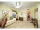 Bedroom features a sofa, ceiling fan, and carpeted floors at 1441 E Hubbell St, Phoenix, AZ 85006