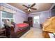 Bedroom features a ceiling fan, pull-out trundle bed, and bright natural light at 1441 E Hubbell St, Phoenix, AZ 85006