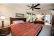 Cozy bedroom features a ceiling fan, mirror wall, and bright natural light at 1441 E Hubbell St, Phoenix, AZ 85006