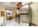Functional kitchen featuring stainless steel appliances, white cabinets, and a cozy dining nook at 1441 E Hubbell St, Phoenix, AZ 85006