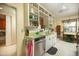 Bright kitchen with white cabinets, green countertops, stainless steel appliances, and adjacent dining area at 1441 E Hubbell St, Phoenix, AZ 85006
