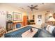 Cozy living room featuring carpet flooring, ceiling fan, unique decor, and comfortable seating at 1441 E Hubbell St, Phoenix, AZ 85006