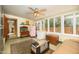Bright sun room features many windows, vintage refrigerator, trunk, and direct access to the exterior of the house at 1441 E Hubbell St, Phoenix, AZ 85006