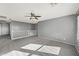 Large bedroom with plush carpet, neutral paint, a ceiling fan, and natural light at 15611 W Cameron Dr, Surprise, AZ 85379