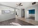 Open floor plan featuring wood-style flooring and seamless access to the rest of the home at 15611 W Cameron Dr, Surprise, AZ 85379