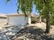Charming single-story home with well-maintained front yard and attached two-car garage at 15706 W Young St, Surprise, AZ 85374
