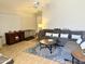 Cozy living room with tile floors, a comfortable sectional, and a ceiling fan at 15706 W Young St, Surprise, AZ 85374