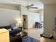 Comfortable living area with a view of the dining room, tile flooring, and plenty of space at 15706 W Young St, Surprise, AZ 85374