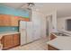 Bright kitchen featuring tile flooring, wood cabinets, and modern appliances perfect for any home chef at 15980 W Quail Creek Ln, Surprise, AZ 85374