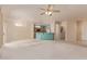 Spacious open-concept layout connecting the living room and kitchen, ideal for gatherings at 15980 W Quail Creek Ln, Surprise, AZ 85374