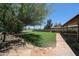 Lush backyard featuring green grass and stone walkways offering a serene outdoor space at 1844 W Virginia Ave, Phoenix, AZ 85007