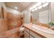 Bathroom features a unique rock shower, sink, and vanity at 1844 W Virginia Ave, Phoenix, AZ 85007