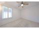 Cozy bedroom featuring a ceiling fan, and a window at 1844 W Virginia Ave, Phoenix, AZ 85007