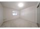 Bright bedroom with neutral carpet, window, and closet at 1844 W Virginia Ave, Phoenix, AZ 85007