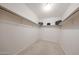 Walk-in closet with built-in shelving and ample storage space for organization at 1844 W Virginia Ave, Phoenix, AZ 85007