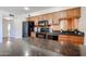 Kitchen with stainless steel appliances, granite counters, and dark wood cabinets at 1844 W Virginia Ave, Phoenix, AZ 85007