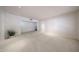 Expansive living room with neutral carpet, recessed lighting and a view into another room at 1844 W Virginia Ave, Phoenix, AZ 85007