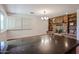 Open-concept living room with stone fireplace, built-in shelves and neutral color palette at 1844 W Virginia Ave, Phoenix, AZ 85007