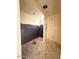 Unfinished bathroom under construction with an unfinished black accent wall and floors at 18751 W Monterosa St, Litchfield Park, AZ 85340