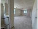 Unfinished living room featuring bare walls and ample natural light streaming through the windows at 18751 W Monterosa St, Litchfield Park, AZ 85340