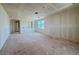Spacious unfinished living room with bright natural light and a layout perfect for future customization at 18751 W Monterosa St, Litchfield Park, AZ 85340