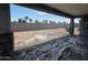 Unfinished patio with a view of the backyard and block wall under a blue sky at 18751 W Monterosa St, Litchfield Park, AZ 85340