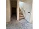 Unfinished staircase and hallway with under construction walls and floors at 18751 W Monterosa St, Litchfield Park, AZ 85340
