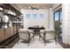 Stylish home office with modern desk, shelving, wood floors, and plenty of natural light at 22673 E San Tan Blvd, Queen Creek, AZ 85142
