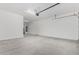 A spacious garage with white paint and an electric garage door at 31476 N Hayweather Ln, San Tan Valley, AZ 85143