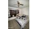 Bedroom featuring tile flooring, a ceiling fan, and abundant natural light, creating a serene atmosphere at 3937 W Stella Ln, Phoenix, AZ 85019